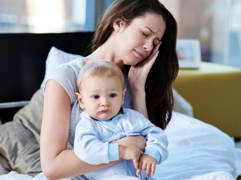 tired mom and baby