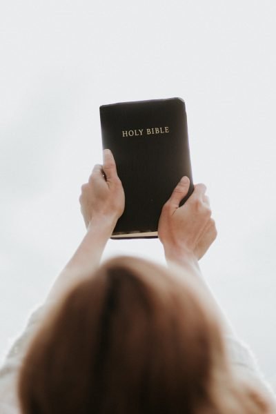 woman holding her Bible