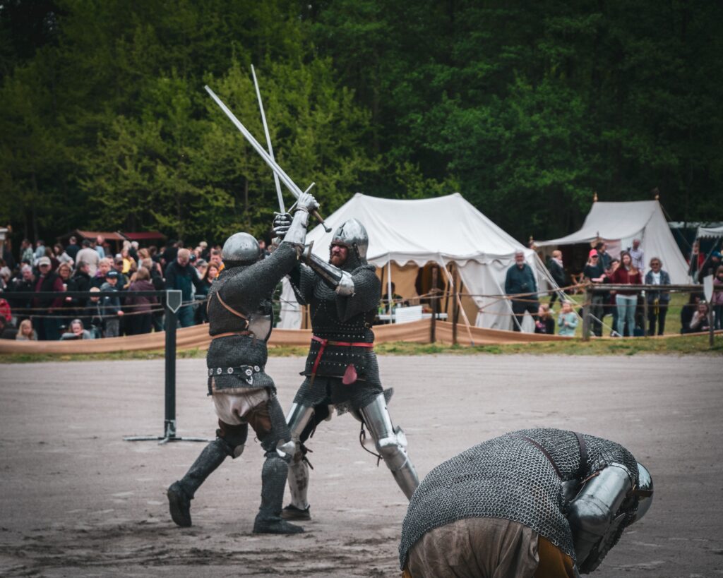 two soldiers fighting with swords