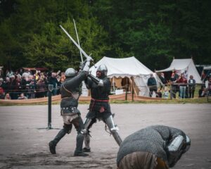 two soldiers fighting with swords